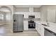 Modern kitchen featuring stainless steel appliances, white cabinetry, and countertops at 9999 Shadow Creek Dr, Orlando, FL 32832