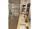 Bathroom featuring a double vanity, large glass shower and a built-in towel display at 117 Darlene Ct, Davenport, FL 33897