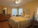Bright bedroom with a decorative bed, ceiling fan, and a classic dresser at 117 Darlene Ct, Davenport, FL 33897