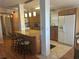 Bright kitchen features granite counters, an island with seating, and stainless steel appliances at 117 Darlene Ct, Davenport, FL 33897