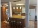 Bright kitchen features granite counters, an island with seating, and stainless steel appliances at 117 Darlene Ct, Davenport, FL 33897