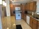 View of a kitchen with granite counters, stainless steel appliances, and tile floors at 117 Darlene Ct, Davenport, FL 33897