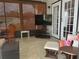 Relaxing enclosed patio space, perfect for entertainment or relaxation with comfortable seating at 117 Darlene Ct, Davenport, FL 33897