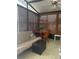 Enclosed sunroom with comfortable seating, ceiling fan, and bamboo window shades at 117 Darlene Ct, Davenport, FL 33897