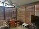 Bright sunroom with dinette set and bamboo blinds, ideal for relaxation at 117 Darlene Ct, Davenport, FL 33897