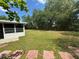 Expansive backyard featuring lush greenery, perfect for relaxation and outdoor entertaining at 12015 Se 72Nd Court Rd, Belleview, FL 34420