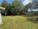 Large backyard with mature trees and an outbuilding provides plenty of possibilities at 12015 Se 72Nd Court Rd, Belleview, FL 34420
