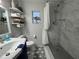 Renovated bathroom featuring a walk-in shower, new vanity, and modern fixtures at 12015 Se 72Nd Court Rd, Belleview, FL 34420