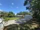Inviting one-story home with a two-car detached garage and beautiful mature trees in the front yard at 12015 Se 72Nd Court Rd, Belleview, FL 34420