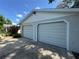 Spacious two-car garage features updated doors and well-maintained exterior at 12015 Se 72Nd Court Rd, Belleview, FL 34420