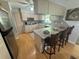 Eat in kitchen featuring stainless steel appliances, a breakfast bar and ample cabinet space at 12015 Se 72Nd Court Rd, Belleview, FL 34420