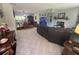 Open-concept living room seamlessly connects to the dining area for easy entertaining and everyday living at 12015 Se 72Nd Court Rd, Belleview, FL 34420