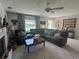 Spacious living room with abundant natural light offers a comfortable and inviting atmosphere at 12015 Se 72Nd Court Rd, Belleview, FL 34420