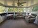 Sun room with lots of windows, natural light and comfortable seating at 12015 Se 72Nd Court Rd, Belleview, FL 34420