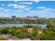 The cityscape view from this home boasts the lake and sunny blue skies at 1209 Gunnison Ave, Orlando, FL 32804