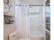 Bathroom features a soaking tub, white subway tile, and modern fixtures at 1209 Gunnison Ave, Orlando, FL 32804