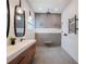 Modern bathroom with double vanity, sleek mirrors, and walk-in shower at 1209 Gunnison Ave, Orlando, FL 32804