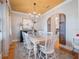 Spacious dining room features a large farmhouse table, elegant chandelier, and unique barn door accents for charm at 1209 Gunnison Ave, Orlando, FL 32804