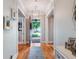 Bright foyer showcasing hardwood floors, stylish decor, and an inviting entryway at 1209 Gunnison Ave, Orlando, FL 32804