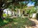Beautiful home with lush landscaping, a cozy front porch, and inviting outdoor spaces at 1209 Gunnison Ave, Orlando, FL 32804