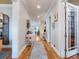 Inviting hallway with hardwood floors, neutral walls, and decorative accents showcases the home's elegant and transitional style at 1209 Gunnison Ave, Orlando, FL 32804