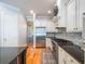 Bright kitchen showcases stainless steel appliances, custom cabinetry, and seamless access to the dining area at 1209 Gunnison Ave, Orlando, FL 32804