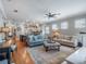 Spacious living room showcasing an open layout, neutral tones, and seamless transition to the kitchen and dining areas at 1209 Gunnison Ave, Orlando, FL 32804