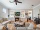 Comfortable living room featuring a fireplace, neutral decor, and inviting seating arrangement perfect for relaxation at 1209 Gunnison Ave, Orlando, FL 32804