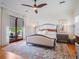 Bright bedroom with a ceiling fan and large windows at 1209 Gunnison Ave, Orlando, FL 32804