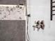 Close up of modern walk-in shower with unique tile and rainfall shower head at 1209 Gunnison Ave, Orlando, FL 32804