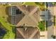 Birds eye view of a home featuring a screened in pool area and well-maintained landscaping at 122 Lower Lake Ct, Debary, FL 32713