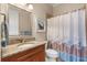 Bathroom featuring granite countertop, wood vanity, toilet and tub with shower at 122 Lower Lake Ct, Debary, FL 32713