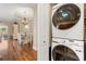 Laundry room adjacent to dining area with view of backyard lake at 122 Lower Lake Ct, Debary, FL 32713