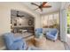 Bright sunroom open to living area, boasting tile floors and plantation shutters at 122 Lower Lake Ct, Debary, FL 32713