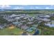 Scenic aerial view of community featuring amenities, sports fields and lush green spaces at 13118 Honey Locust Dr, Orlando, FL 32828