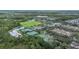 Aerial view of community amenities including sports fields, playground, and lush landscaping at 13118 Honey Locust Dr, Orlando, FL 32828