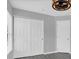 A bedroom with a double door closet and light-colored walls and flooring at 13118 Honey Locust Dr, Orlando, FL 32828