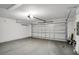 Spacious garage with high ceilings and an automatic garage door at 13118 Honey Locust Dr, Orlando, FL 32828