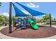 Community playground with slides, climbing structures, and sunshade for enjoyment at 13118 Honey Locust Dr, Orlando, FL 32828