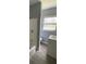 Well-maintained bathroom featuring a shower-tub combo, modern vanity, and sleek flooring for a functional and stylish space at 1312 Simmons Rd, Kissimmee, FL 34744