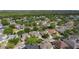 Aerial view of a neighborhood showcasing lush greenery, mature trees, and well-maintained homes at 13139 Paloma Dr, Orlando, FL 32837