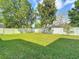 Large, well-maintained backyard with a white picket fence, perfect for outdoor activities at 13139 Paloma Dr, Orlando, FL 32837