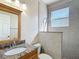 This bathroom has granite counters, decorative backsplash, a decorative mirror and a step-in shower at 13139 Paloma Dr, Orlando, FL 32837