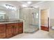 Modern bathroom featuring a glass shower, double vanity, and closet at 13139 Paloma Dr, Orlando, FL 32837