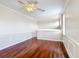 Hardwood floor bedroom with neutral walls, large window and ceiling fan at 13139 Paloma Dr, Orlando, FL 32837