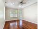 Cozy bedroom with hardwood floors, ceiling fan, and natural light at 13139 Paloma Dr, Orlando, FL 32837