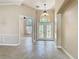 Inviting foyer features tile flooring, high ceilings, and a decorative glass front door allowing natural light at 13139 Paloma Dr, Orlando, FL 32837