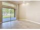 Bright living room with tile floors and sliding glass doors providing access to outdoor space and natural light at 13139 Paloma Dr, Orlando, FL 32837