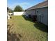 Wide backyard featuring well-maintained grass and ample space, perfect for outdoor enjoyment at 1381 Woodlark Dr, Haines City, FL 33844