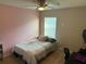 Bedroom with neutral wall colors, natural light, a desk area, and carpet flooring at 1381 Woodlark Dr, Haines City, FL 33844